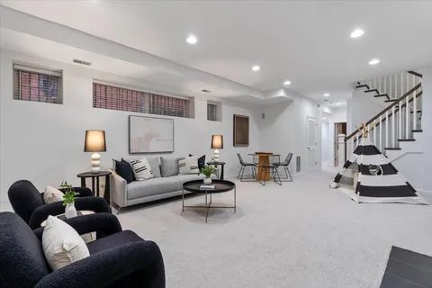 a view of a roof deck with wooden floor and fence