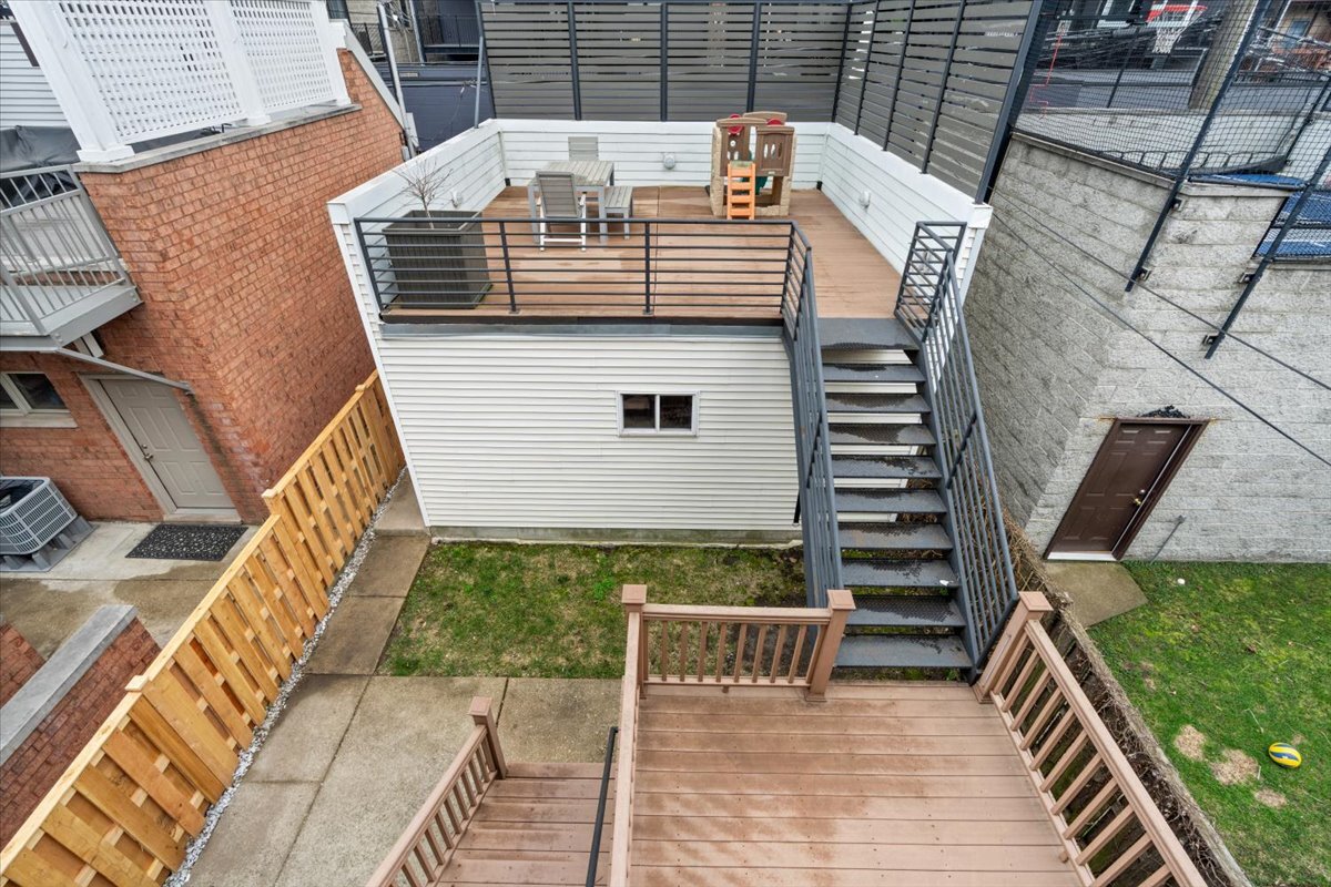1937 West Melrose Street Chicago, IL 60657 - Photo 34 of 41 a view of balcony with wooden floor and outdoor seating