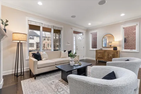 a living room with furniture fireplace and lamp