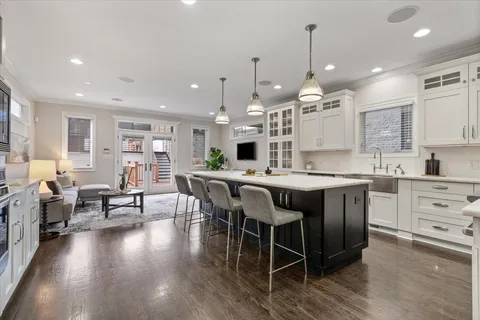 a kitchen with stainless steel appliances granite countertop a stove and a sink