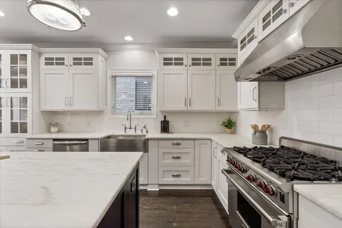 a kitchen with cabinets a sink and appliances