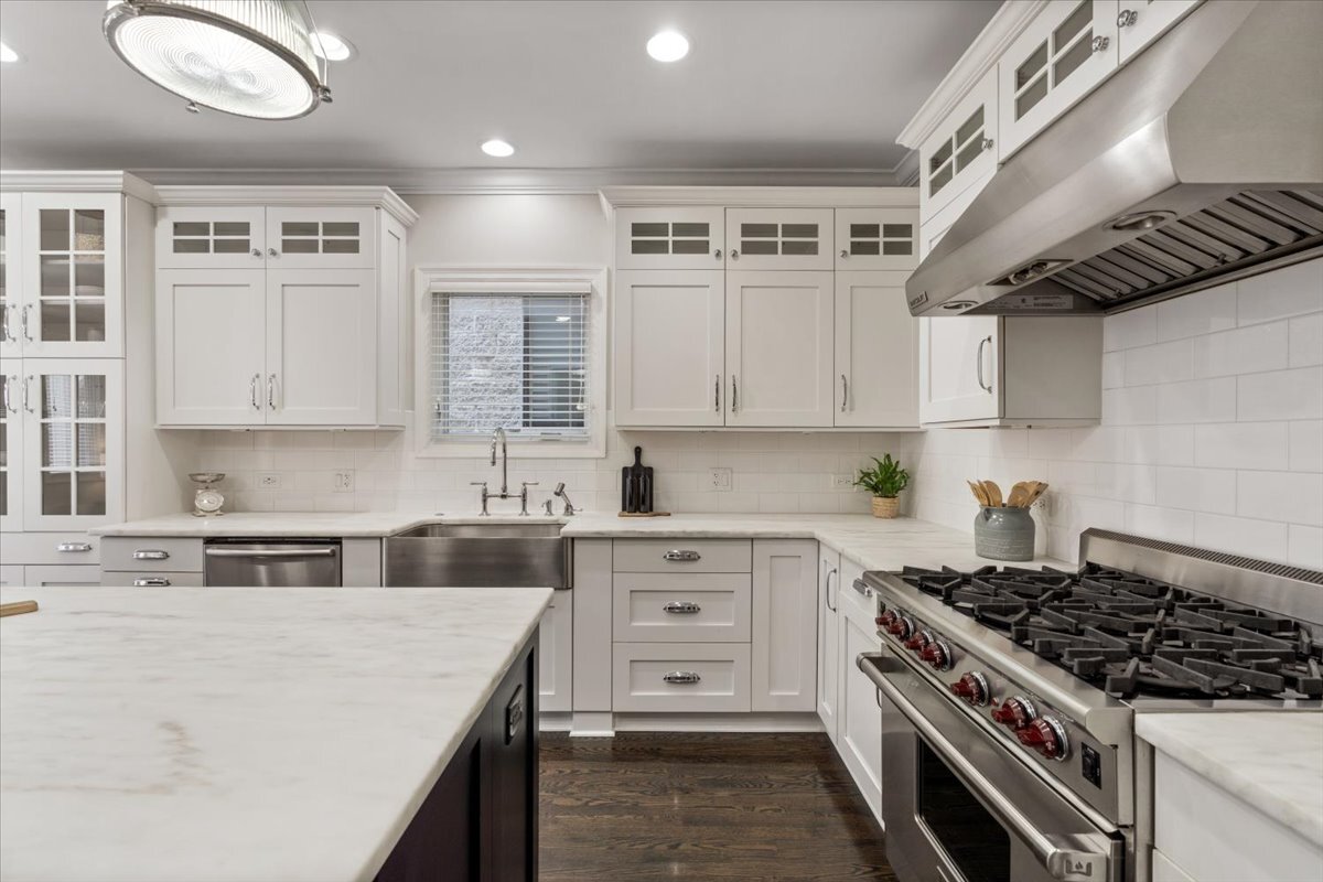 1937 West Melrose Street Chicago, IL 60657 - Photo 9 of 41 a kitchen with stainless steel appliances granite countertop a stove and a sink