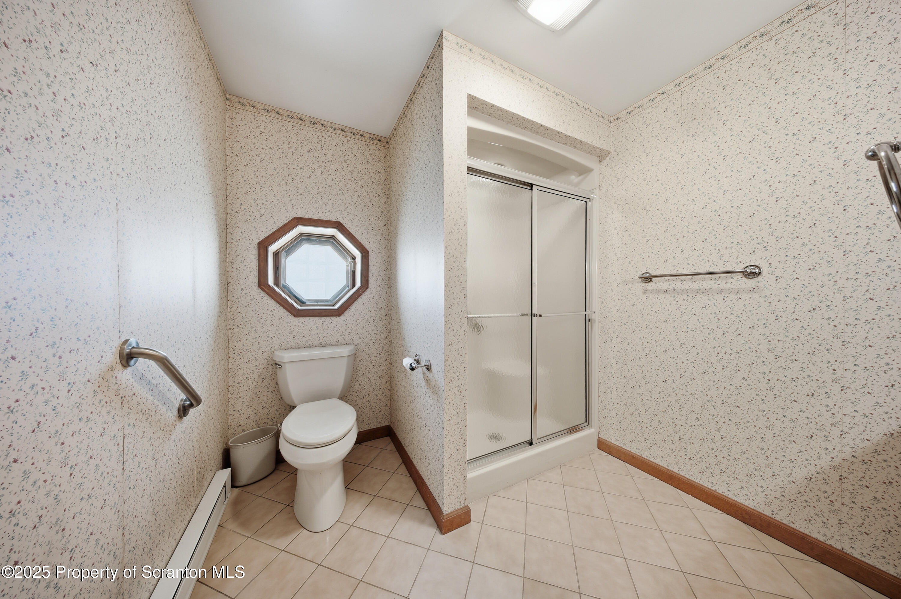 612 Philo Street Scranton, PA 18508 - Photo 11 of 22 a bathroom with a toilet and a mirror
