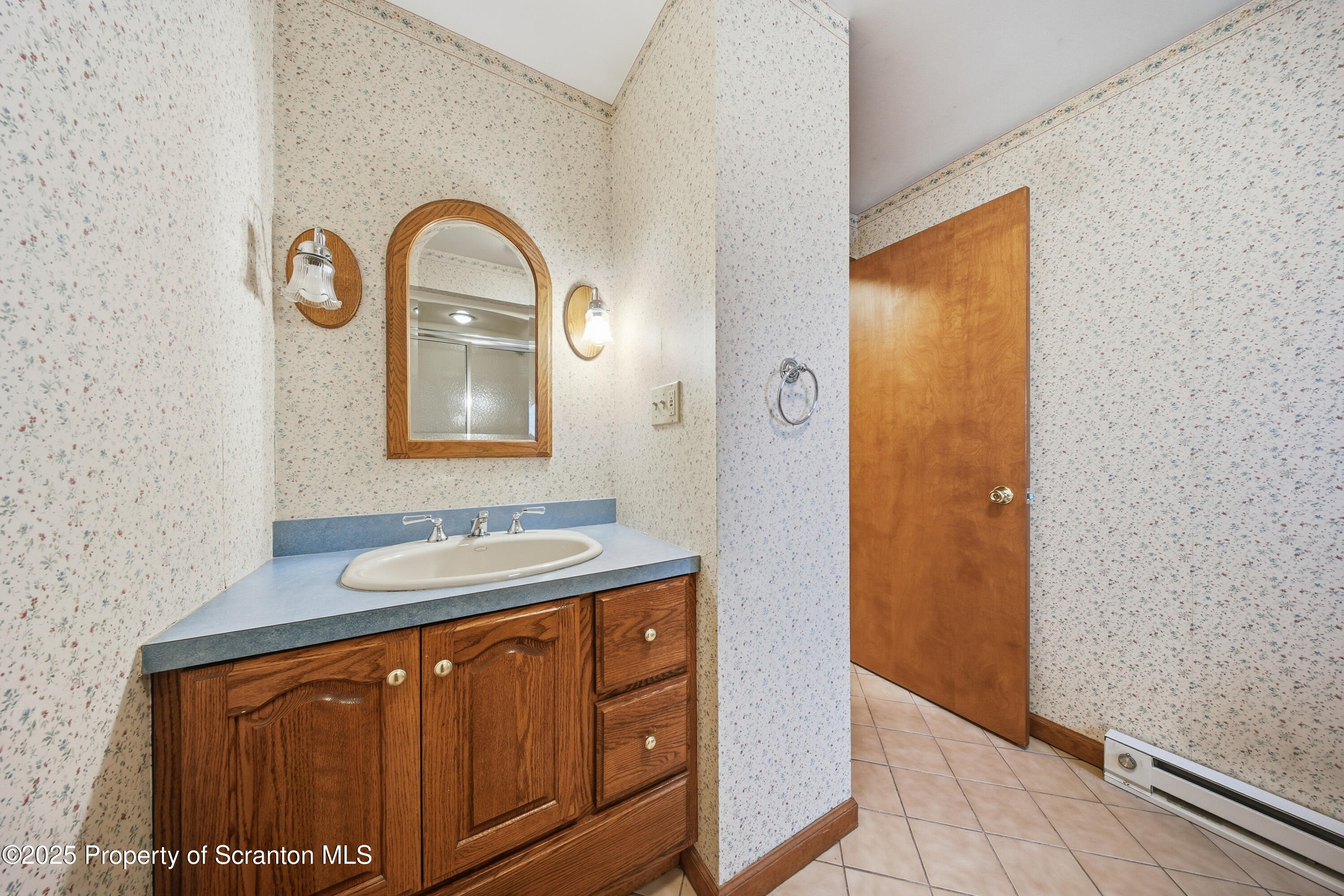 612 Philo Street Scranton, PA 18508 - Photo 12 of 22 a bathroom with a sink and a mirror