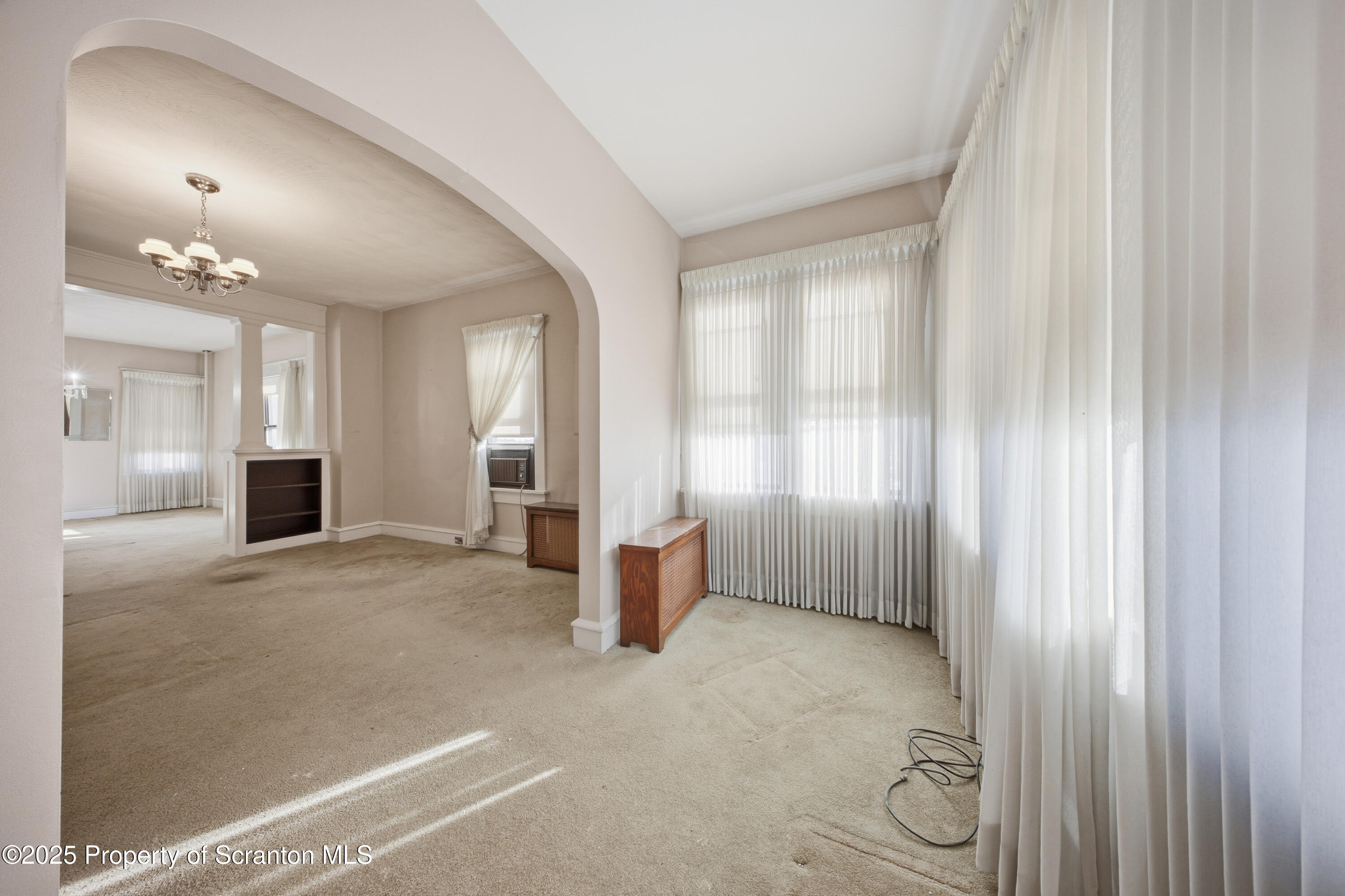 612 Philo Street Scranton, PA 18508 - Photo 4 of 22 a view of a big room with windows and cabinet