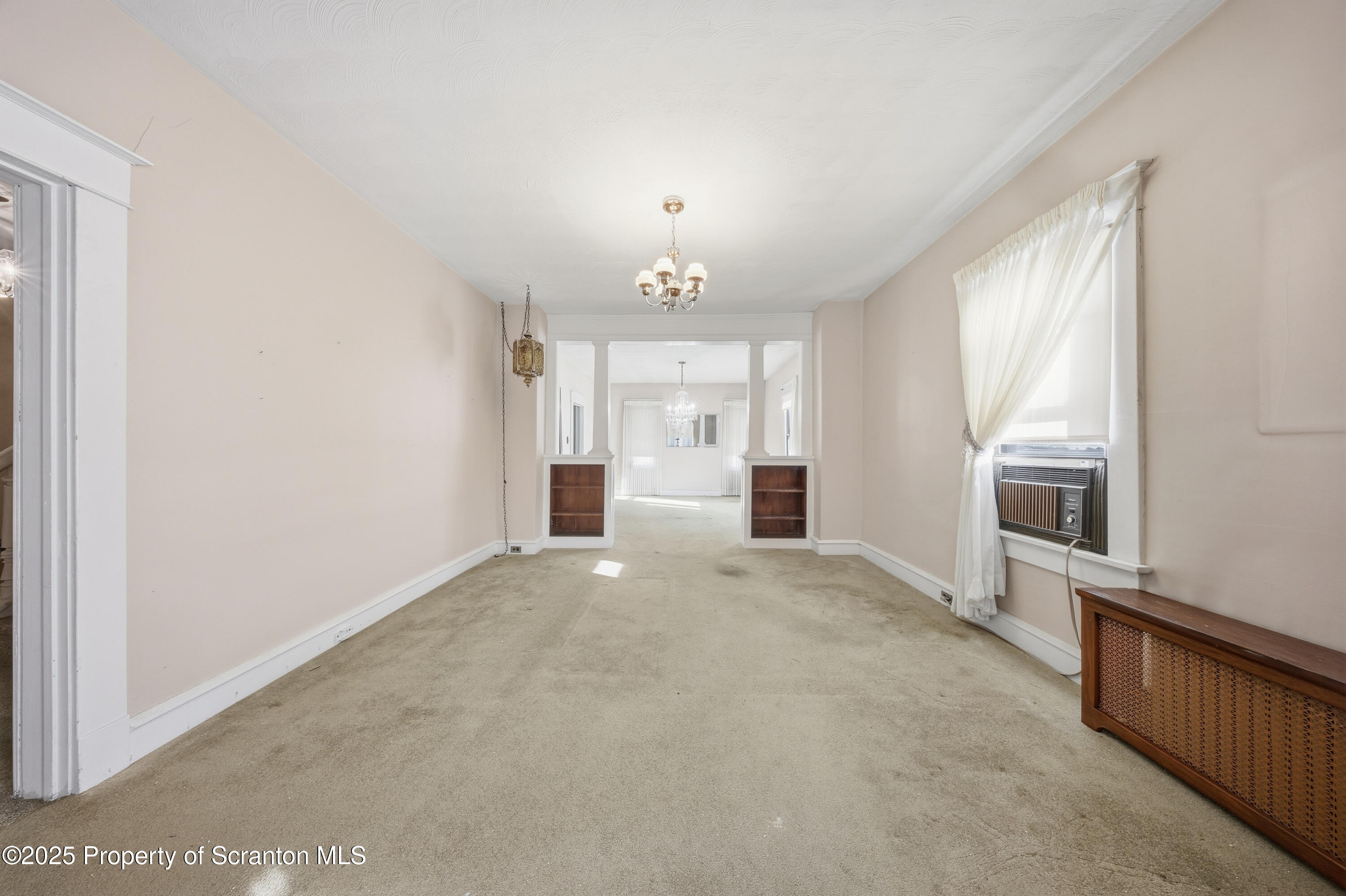 612 Philo Street Scranton, PA 18508 - Photo 5 of 22 a view of an empty room with a window