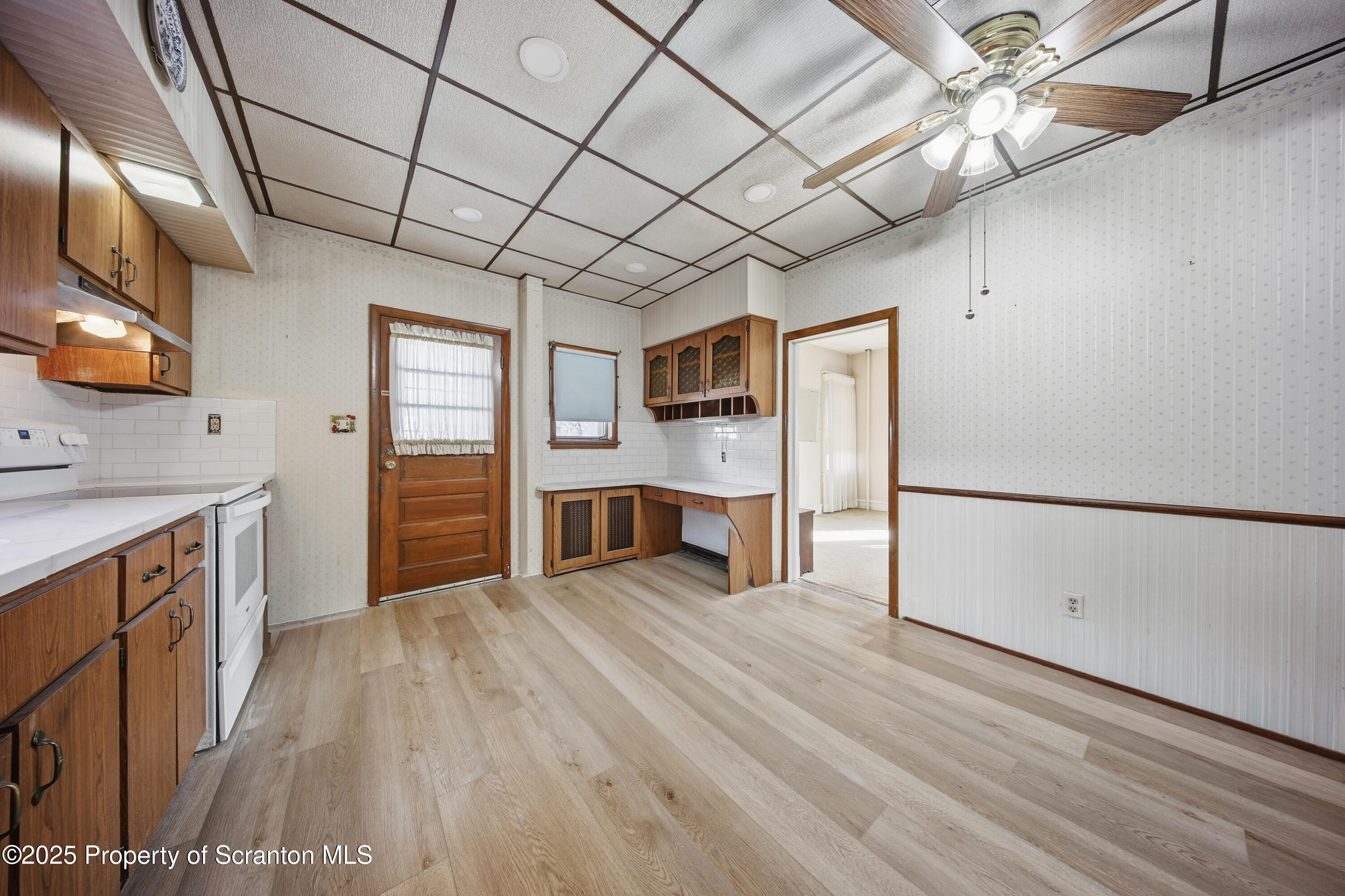 612 Philo Street Scranton, PA 18508 - Photo 8 of 22 a view of a kitchen with a sink cabinets and wooden floor