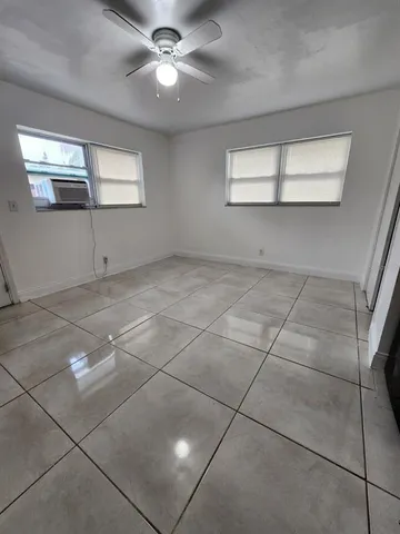 a view of an empty room with a window
