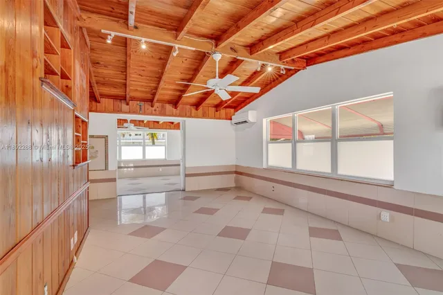 a bathroom with a bathtub and window