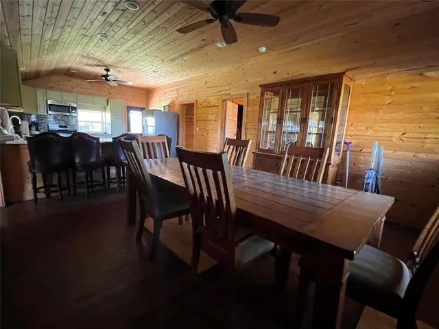 a kitchen with stainless steel appliances granite countertop a refrigerator a stove top oven a sink and dishwasher