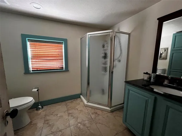 a bed sitting in a room next to a building