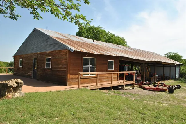 a reading room with wooden furniture and wooden floors