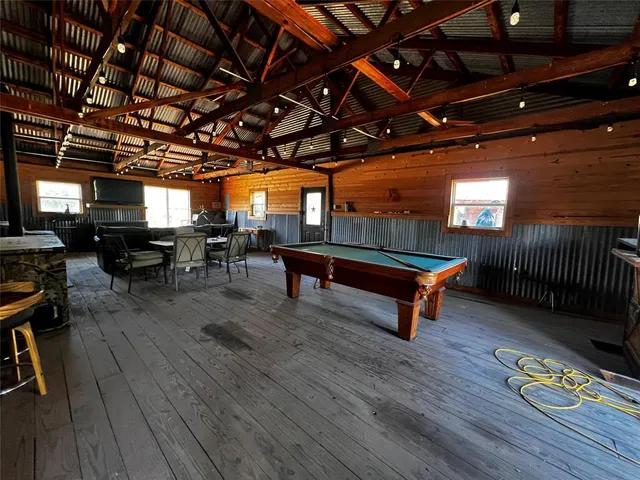 a view of a backyard with sitting area