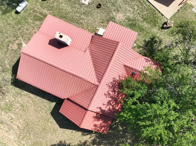 an aerial view of beach and yard