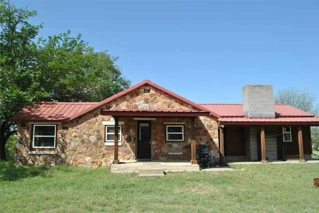a view of grassy field with trees