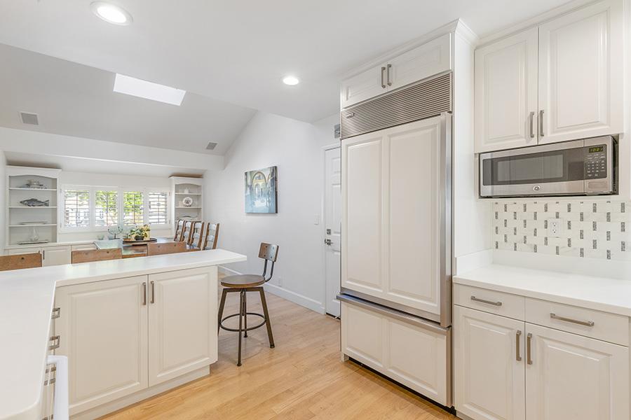 2171 Cedar Avenue Menlo Park, CA 94025 - Photo 11 of 45 a kitchen with white cabinets and stainless steel appliances