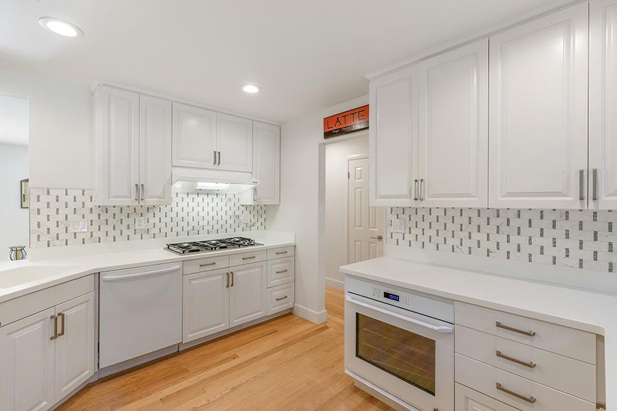 2171 Cedar Avenue Menlo Park, CA 94025 - Photo 13 of 45 a kitchen with white cabinets and white appliances