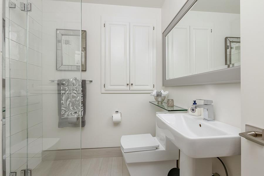 2171 Cedar Avenue Menlo Park, CA 94025 - Photo 18 of 45 a bathroom with a sink a toilet and mirror
