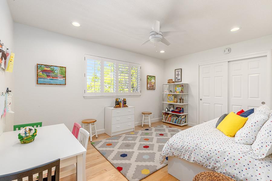 2171 Cedar Avenue Menlo Park, CA 94025 - Photo 34 of 45 a bedroom that has a bed and a bookshelf in it