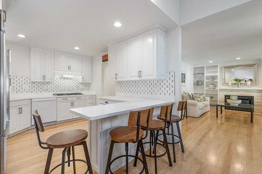 2171 Cedar Avenue Menlo Park, CA 94025 - Photo 9 of 45 a kitchen with a table chairs stove and kitchen island
