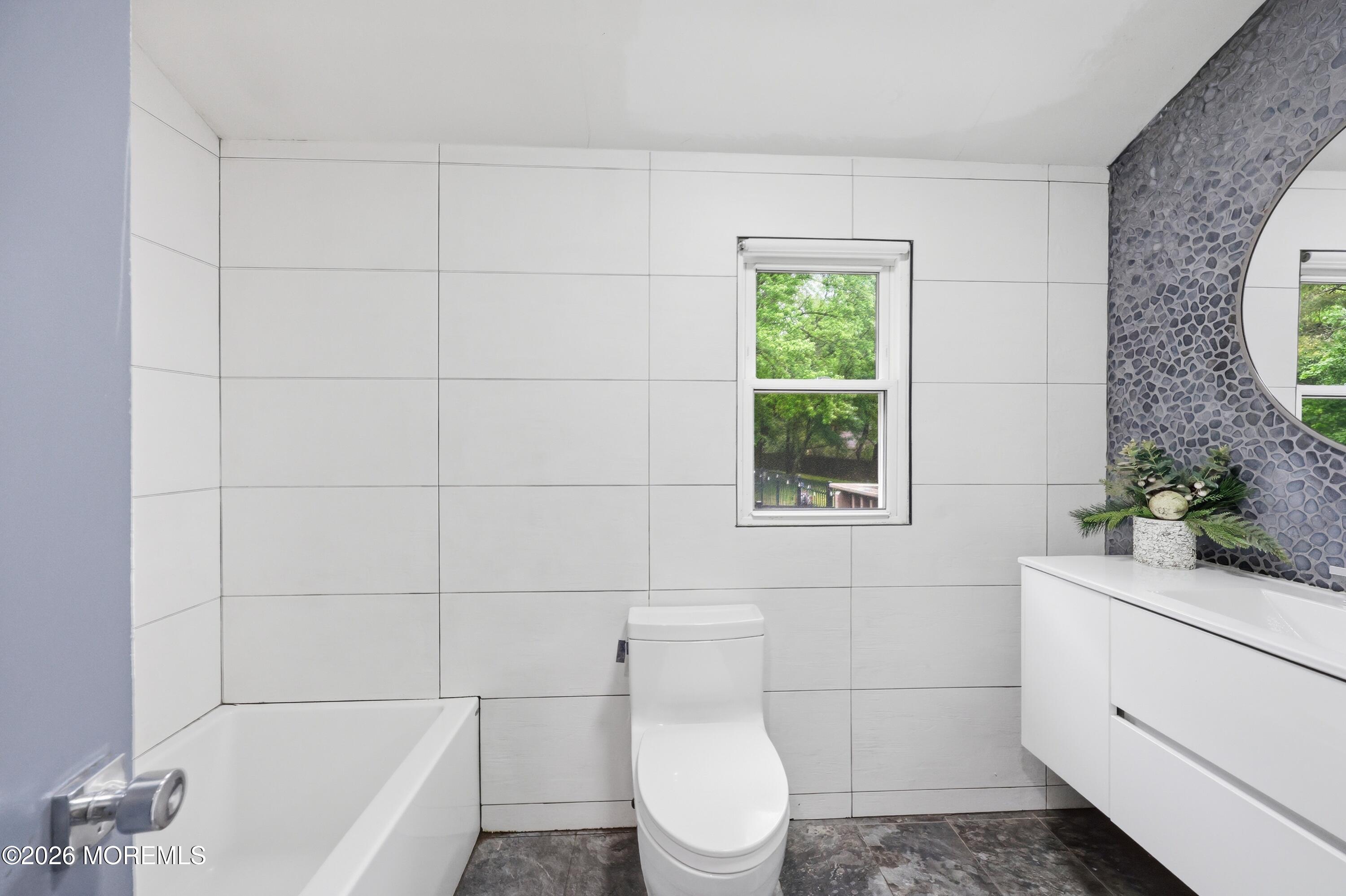 1845 Old Freehold Road Toms River, NJ 08755 - Photo 20 of 27 a bathroom with a toilet a sink and window