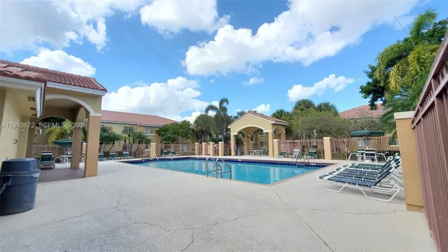 a view of a house with basketball court