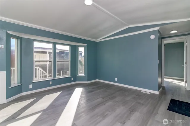 a view of a kitchen with a sink and a refrigerator
