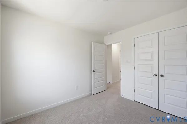 an empty room with closet area
