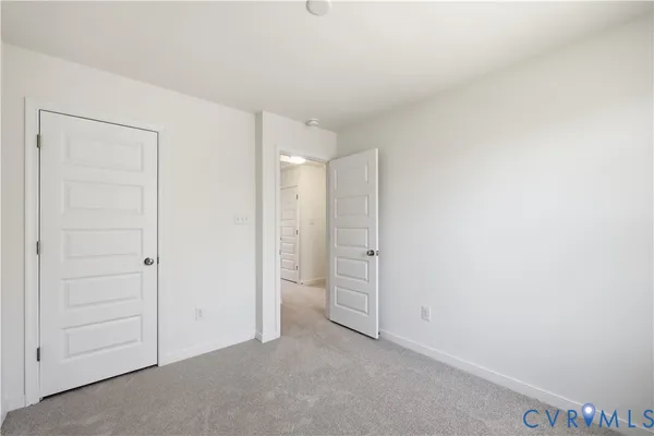 an empty room with closet area