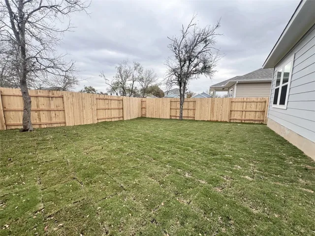 a view of a backyard of the house