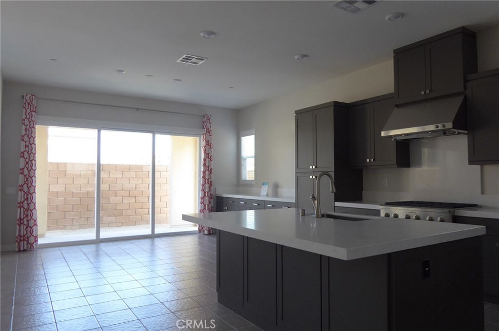 652 Athos Lake Forest, CA 92630 - Photo 2 of 13 a kitchen with granite countertop a sink stainless steel appliances and cabinets