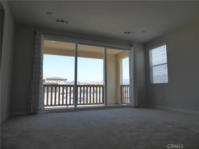 a view of a big room with windows