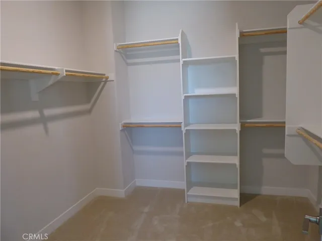 a view of an empty walk in closet