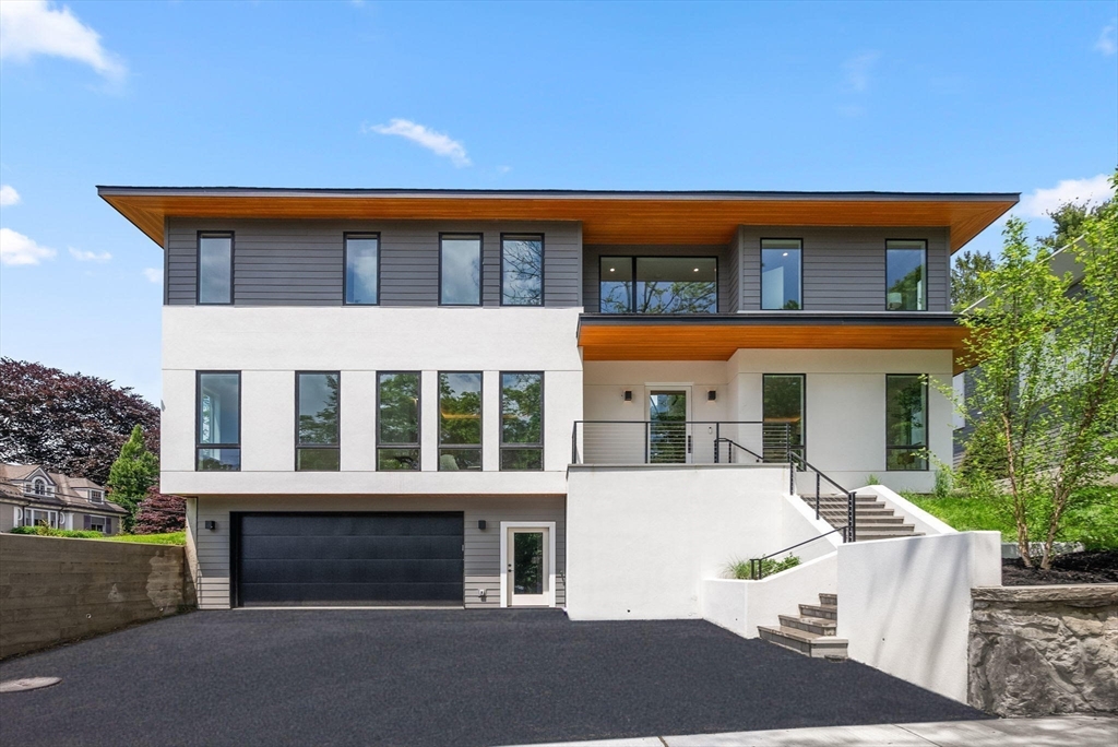 225 Gardner Road Brookline, MA 02445 - Photo 2 of 2 a front view of a house with a yard