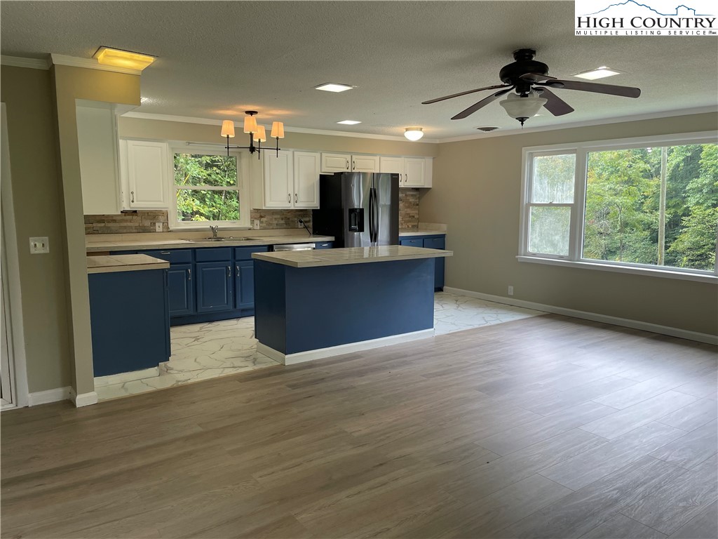 274 Bryan Davis Road Creston, NC 28615 - Photo 12 of 29 a kitchen with stainless steel appliances granite countertop a sink stove and refrigerator