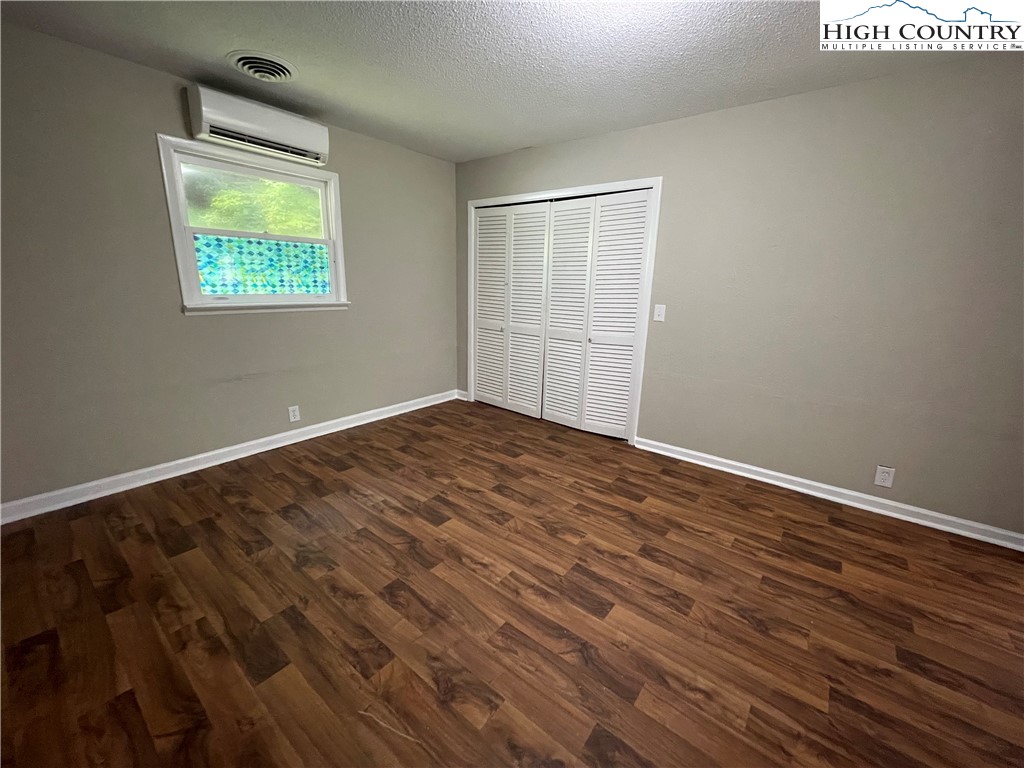 274 Bryan Davis Road Creston, NC 28615 - Photo 26 of 29 wooden floor in an empty room