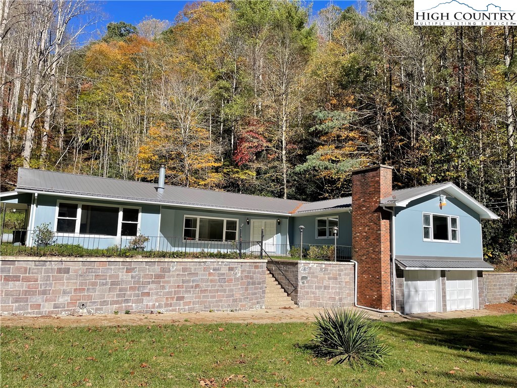 274 Bryan Davis Road Creston, NC 28615 - Photo 3 of 29 a front view of a house with garden