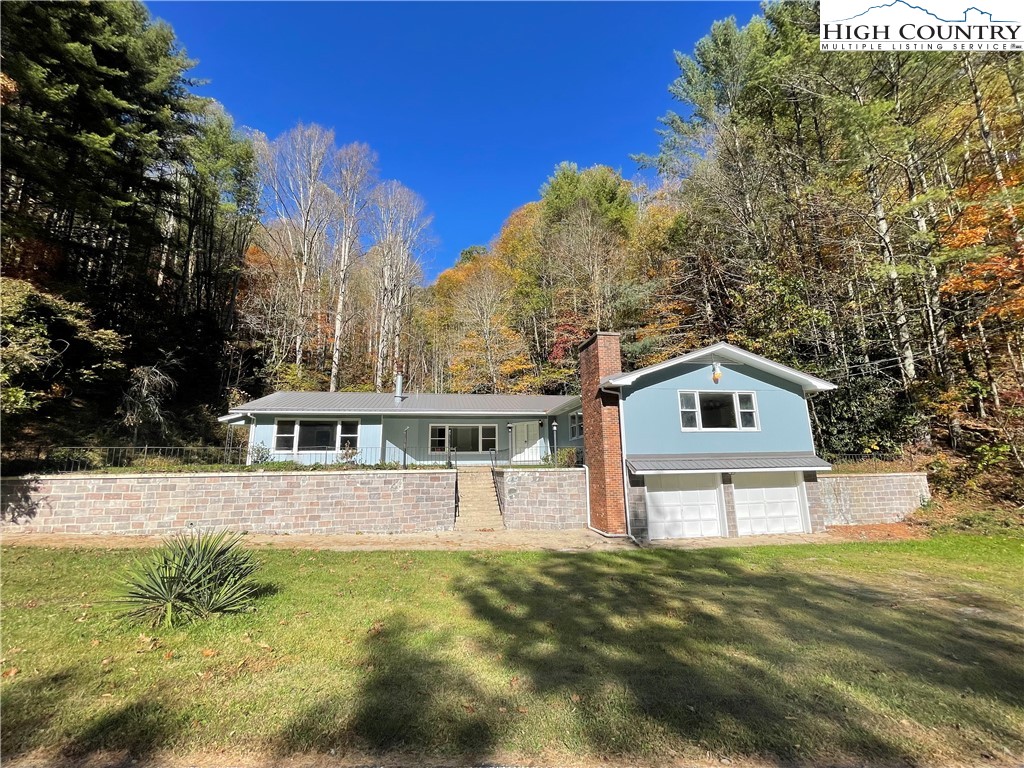 274 Bryan Davis Road Creston, NC 28615 - Photo 6 of 29 a front view of a house with a yard