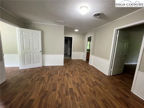 a open kitchen with a table and chairs in it