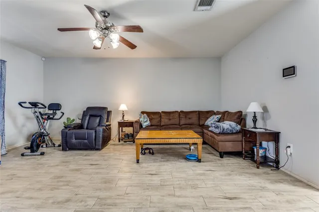 a bedroom with furniture and a chandelier