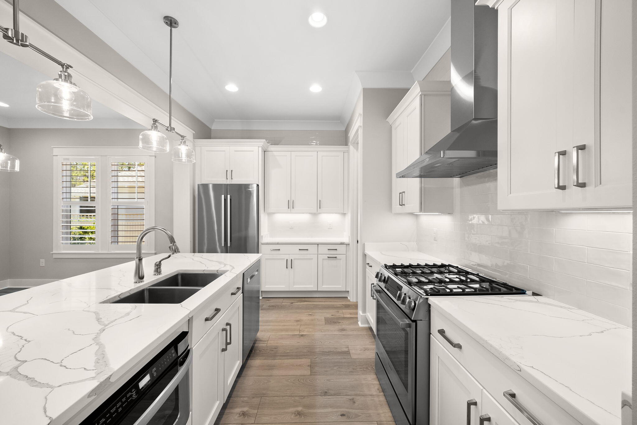 64 West Firethorn Circle Watersound, FL 32461 - Photo 12 of 63 a kitchen with white cabinets and appliances