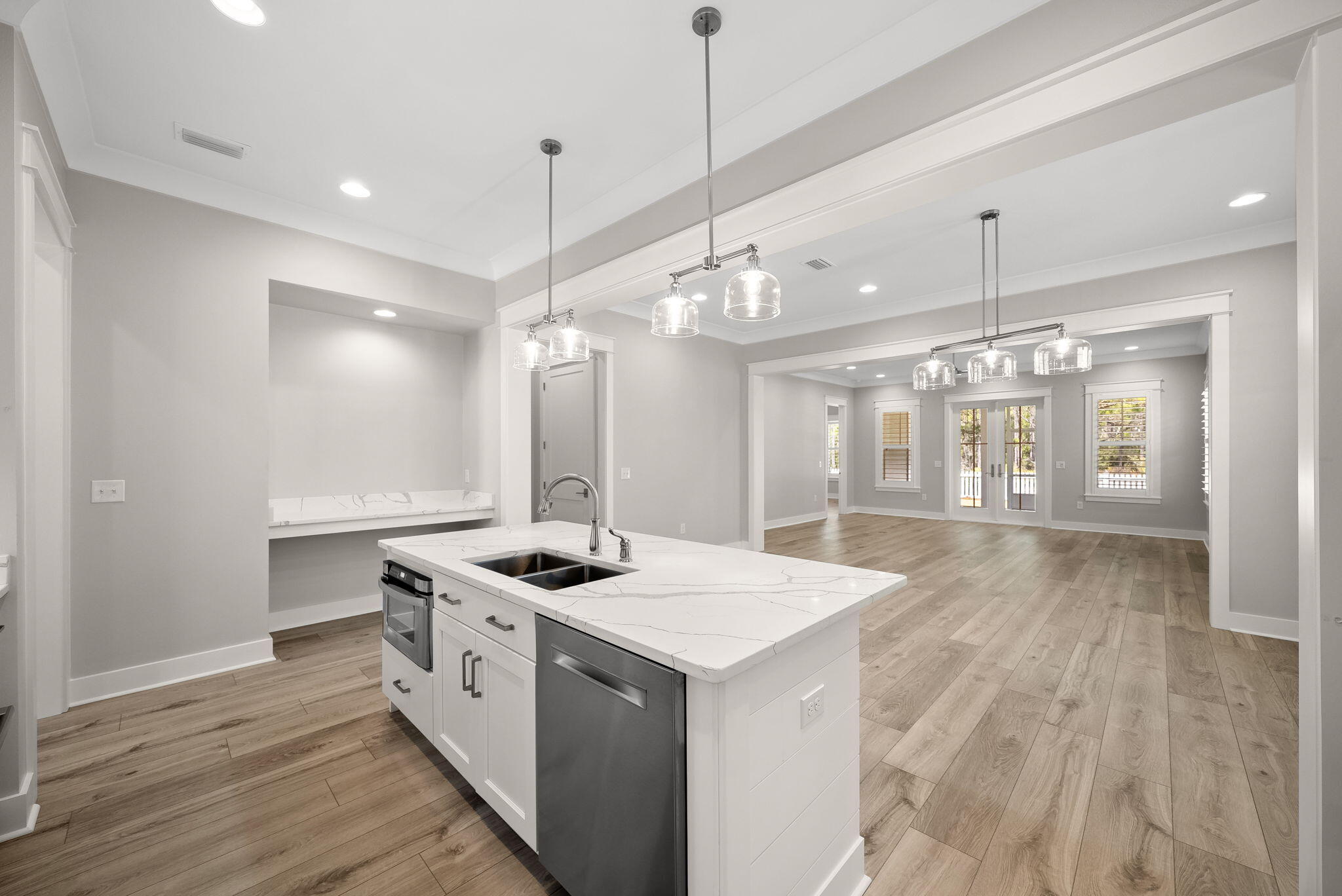 64 West Firethorn Circle Watersound, FL 32461 - Photo 13 of 63 a kitchen that has a lot of cabinets and wooden floor