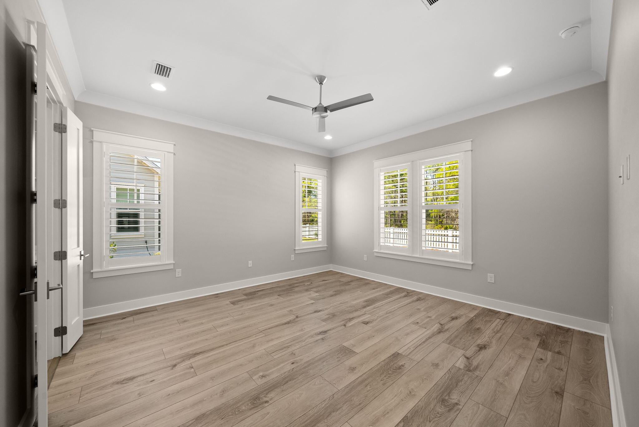 64 West Firethorn Circle Watersound, FL 32461 - Photo 18 of 63 wooden floor in an empty room with a window