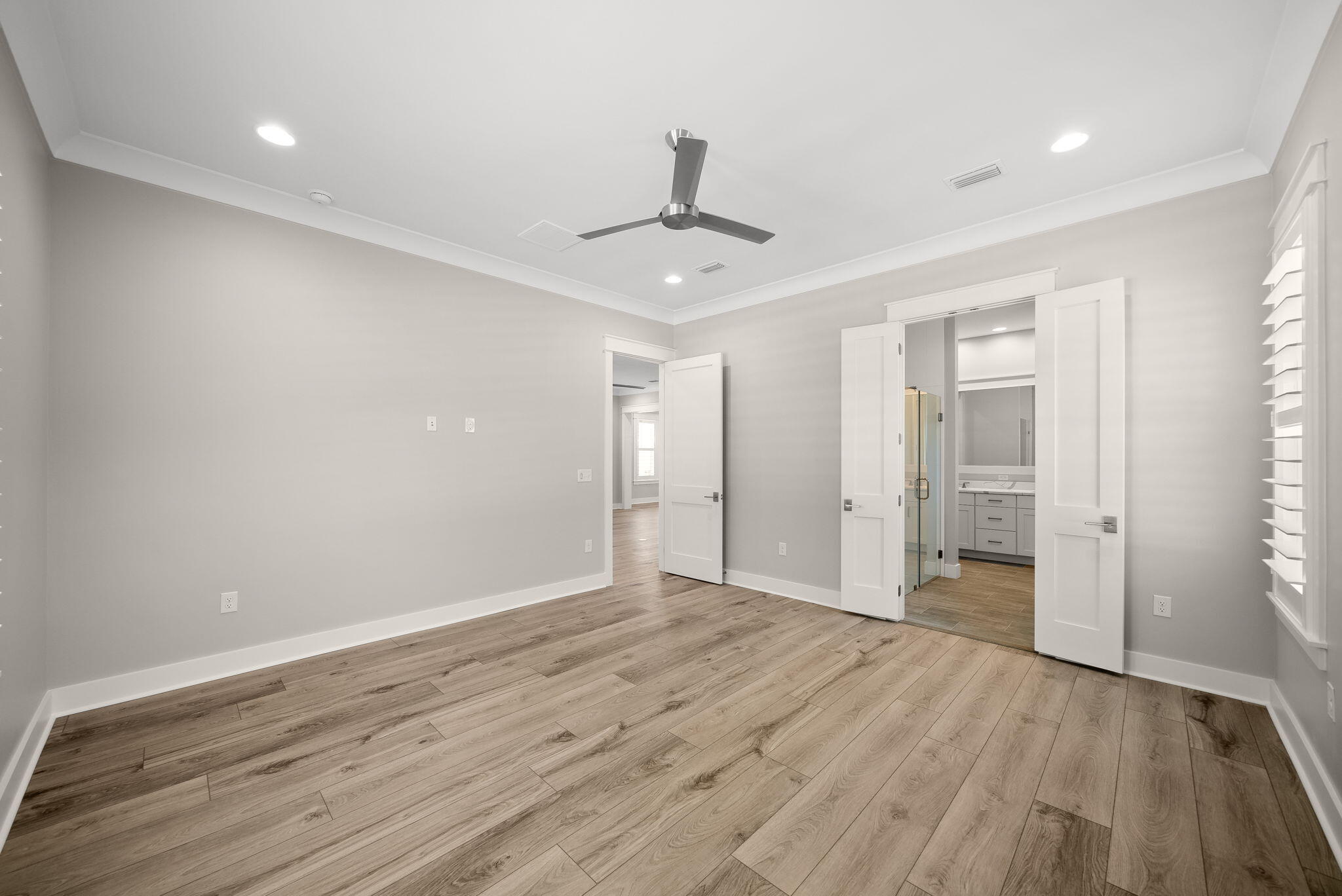 64 West Firethorn Circle Watersound, FL 32461 - Photo 19 of 63 wooden floor in an empty room with a window