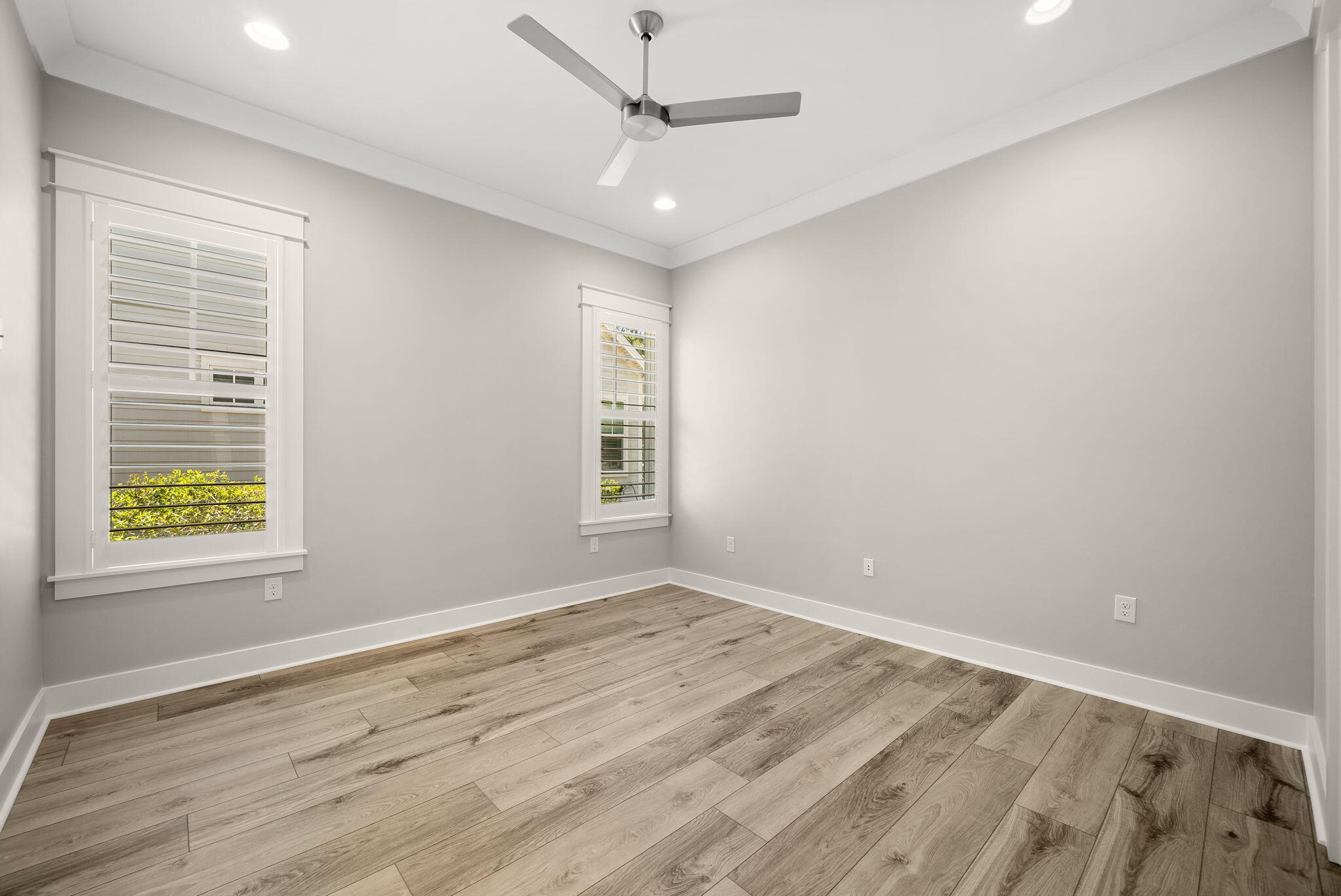 64 West Firethorn Circle Watersound, FL 32461 - Photo 23 of 63 an empty room with windows and fan