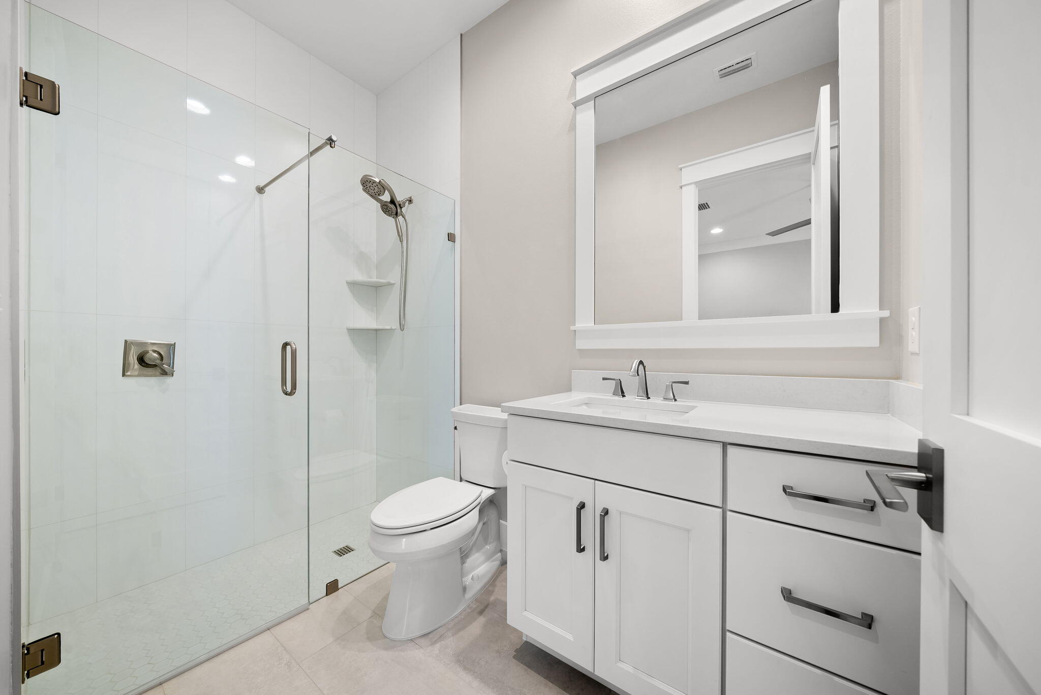 64 West Firethorn Circle Watersound, FL 32461 - Photo 25 of 63 a bathroom with a sink a toilet and shower