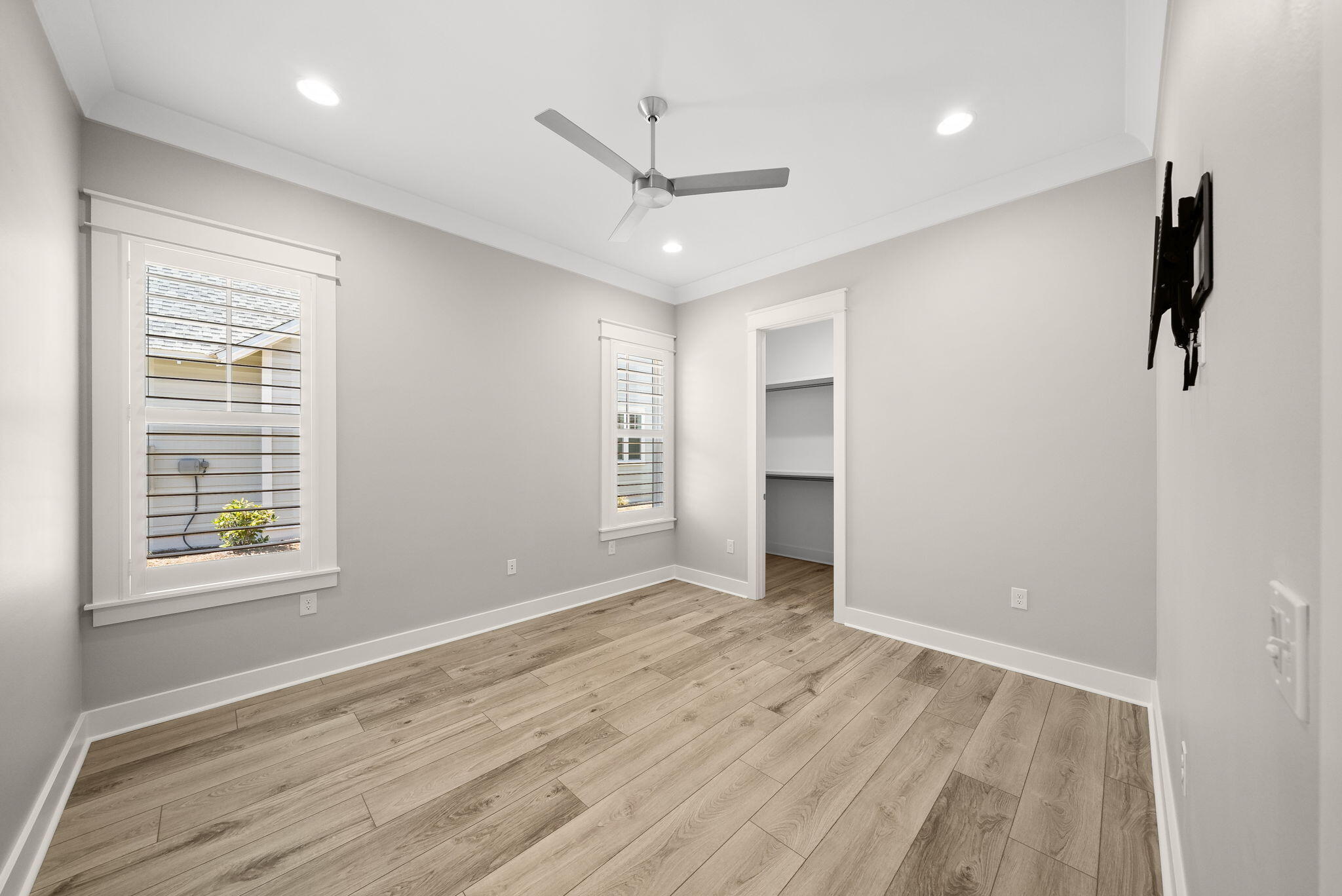 64 West Firethorn Circle Watersound, FL 32461 - Photo 26 of 63 wooden floor in an empty room with a window