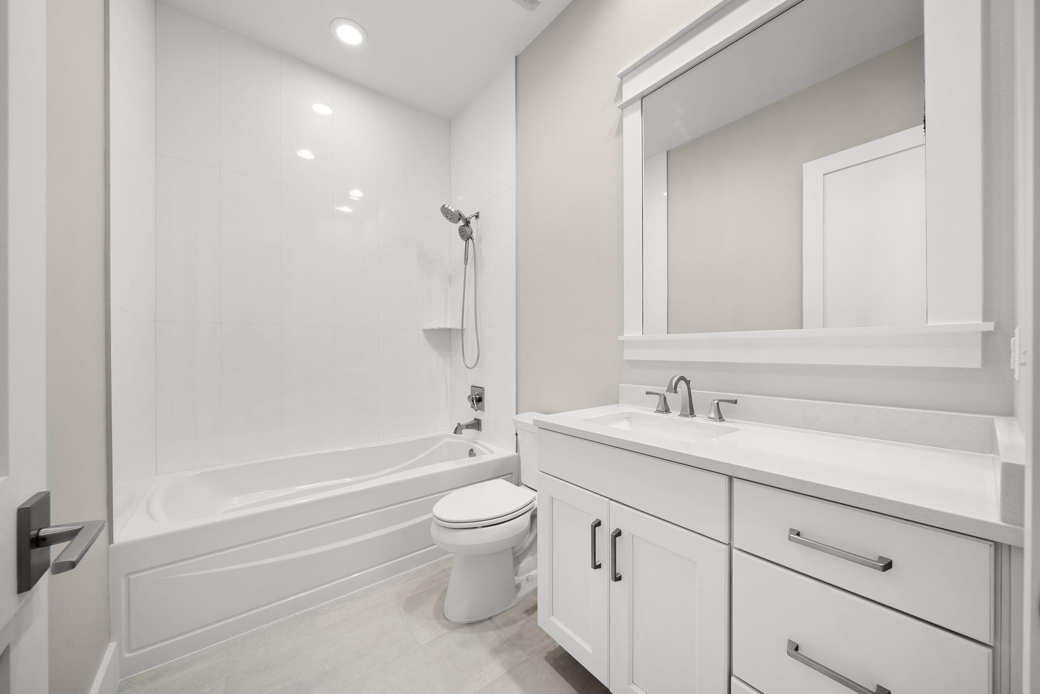 64 West Firethorn Circle Watersound, FL 32461 - Photo 30 of 63 a bathroom with a granite countertop toilet a sink and a bathtub