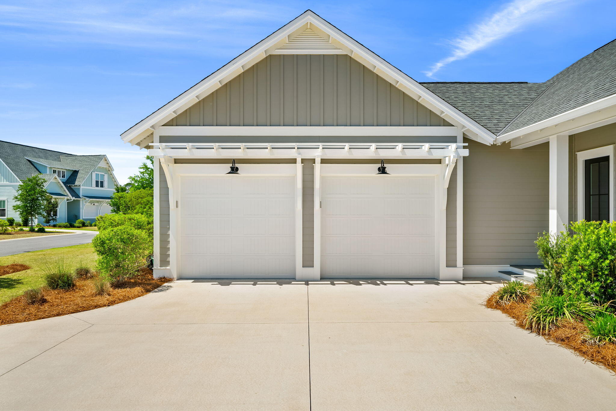 64 West Firethorn Circle Watersound, FL 32461 - Photo 3 of 63 a front view of a house with a garage