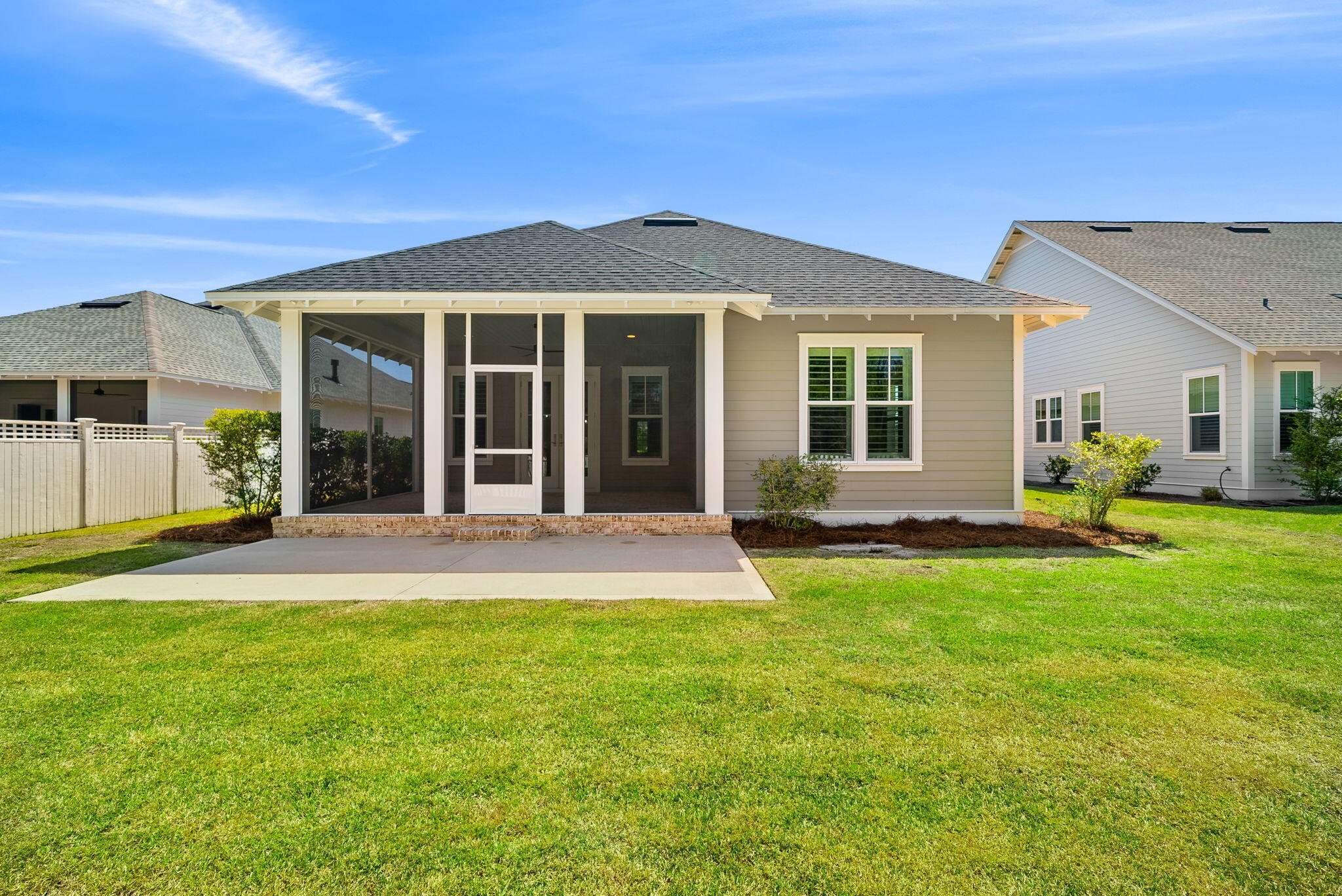 64 West Firethorn Circle Watersound, FL 32461 - Photo 38 of 63 a view of a house with a yard and porch